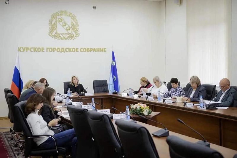 город